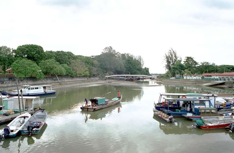 Punting a boat in Changi Creek